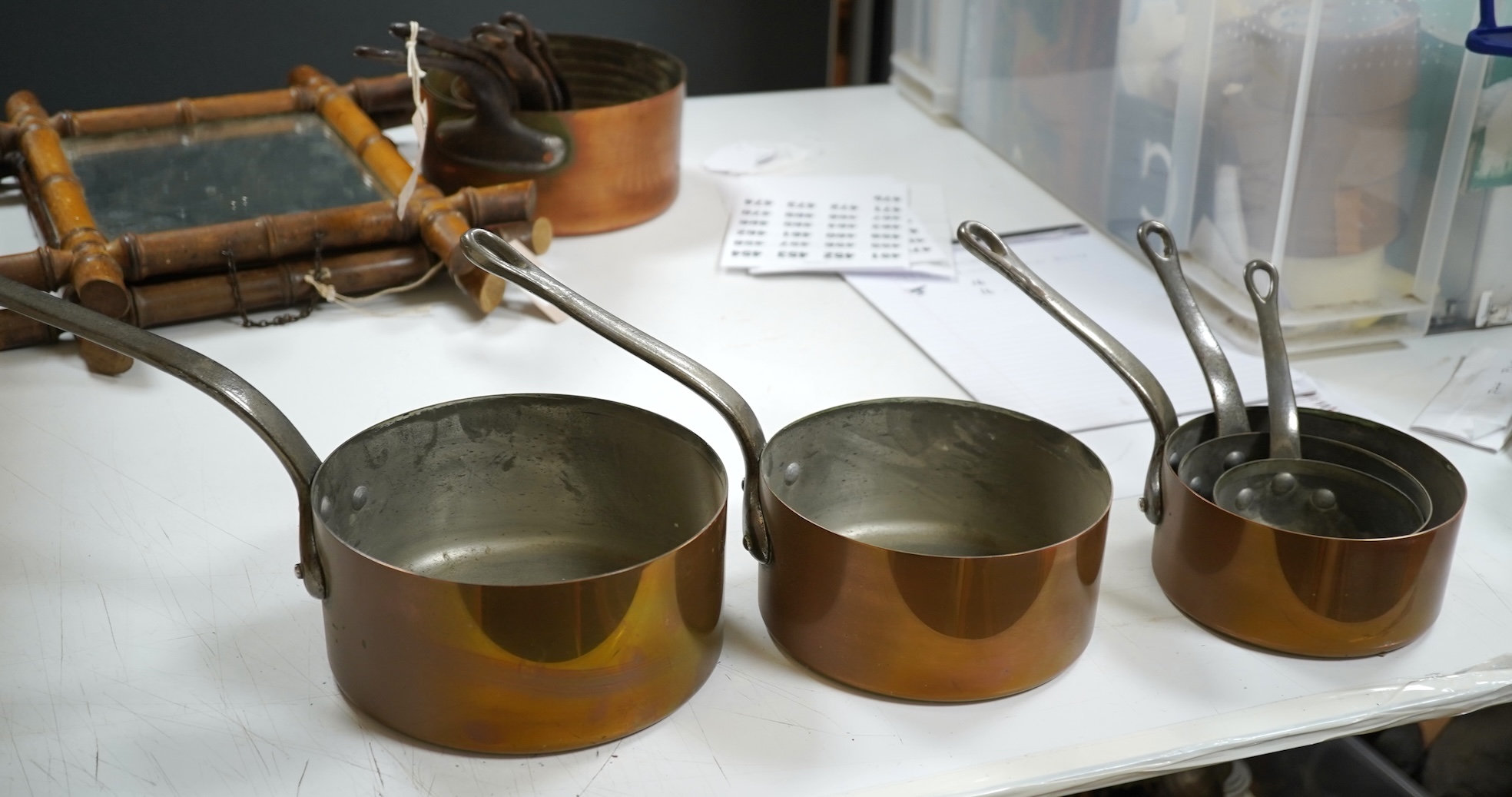 A graduated set of five French copper pans